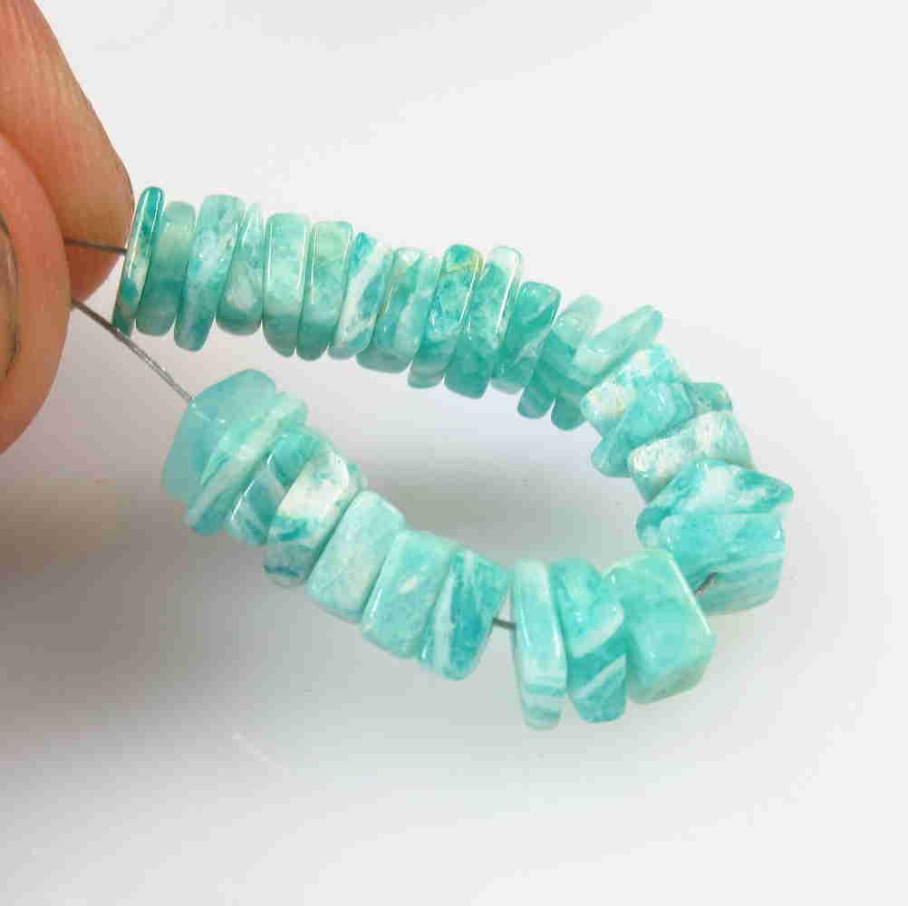 15.26 Ctw Natural 33 Drilled Amazonite Square Beads: No Reserve! Title: 15.26 Ctw Natural 33 Drilled Amazonite Square Beads Stone Clarity: Opaque Gemstone: Amazonite Beads Carat Weight: 15.26 Size/Dimensions: 5.0x4.7 to 5.6x5.4 mm / 33 PC's Additional I