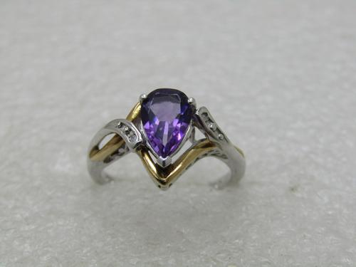 Sterling and 10kt Lab Amethyst & Diamond Ring, Sz.: Sterling and 10kt Lab Amethyst & Diamond Ring, Sz. 6.75. Pear-Shaped Stone appx. 1.15 TCW with two 1mm diamond chips. Weight is appx. 3.17 gr. This is marked .925 and 10kt. This has 10kt yellow gold f