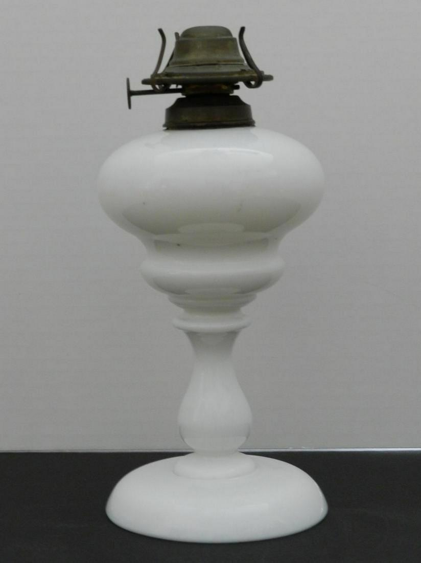 Milk Glass Oil Lamp: Title: Milk Glass Oil Lamp Additional Information: Milk Glass Oil Lamp Base with Burner. Excellent Condition, Missing Glass Chimney. 10” Tall to Top of Burner Shipping: Domestic: Flat-rate of $2