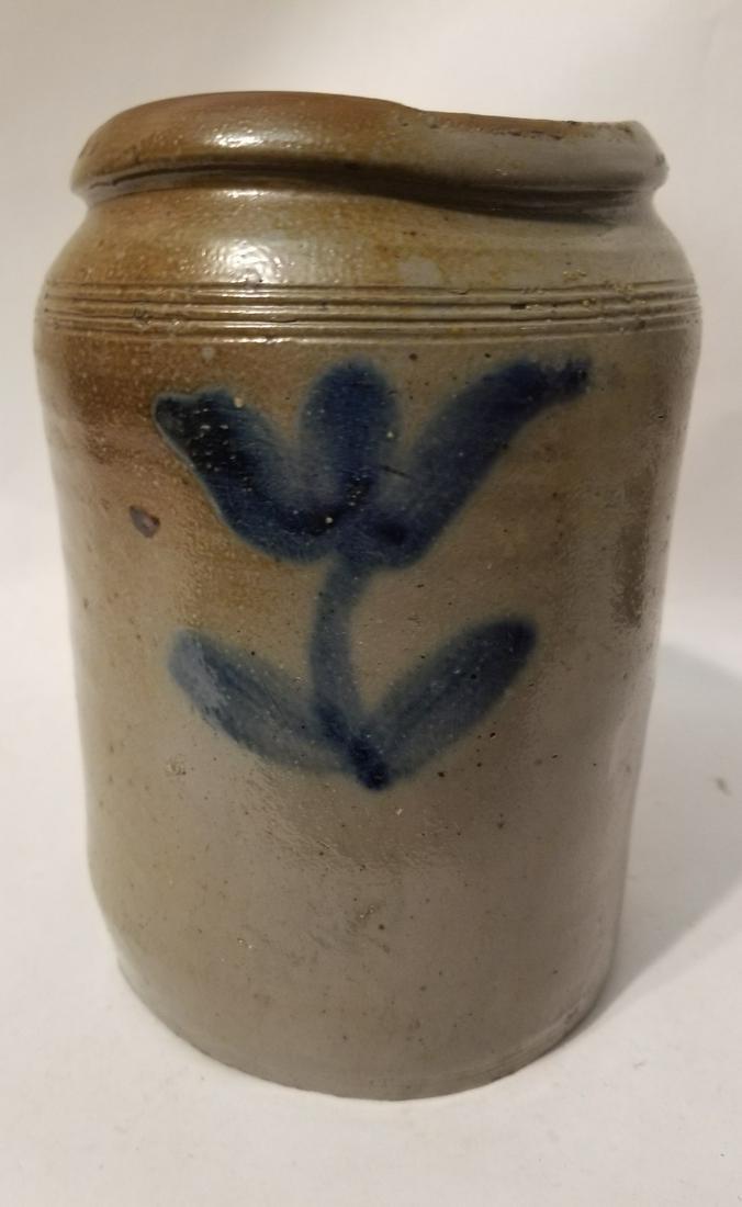 Half-gallon stoneware jar with a flared tulip on each (1 of 2)