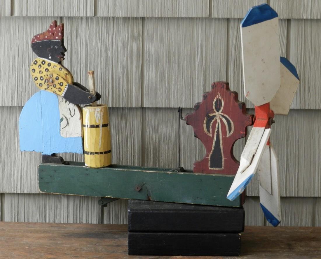 Black Americana Folk Art Whirligig: Title: Black Americana Folk Art Whirligig Additional Information: Black Americana Folk Art Whirligig of a Woman Churning Butter. Original Colorful Paint, Early to Mid 20th Century. Barn Found and In O