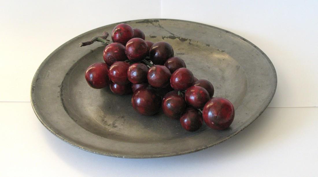 Cluster of vintage stone grapes. (1 of 2)