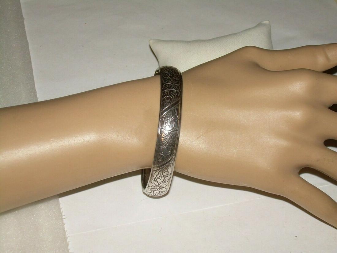Vintage 1940's Beau Sterling Bracelet - Floral Leaf: Vintage 1940's sterling silver bangle bracelet. The bracelet is marked Beau sterling. The bracelet weighs 14 grams. Reserve: $20.00 Shipping: Domestic: Flat-rate of $5.00 to anywhere within the contig