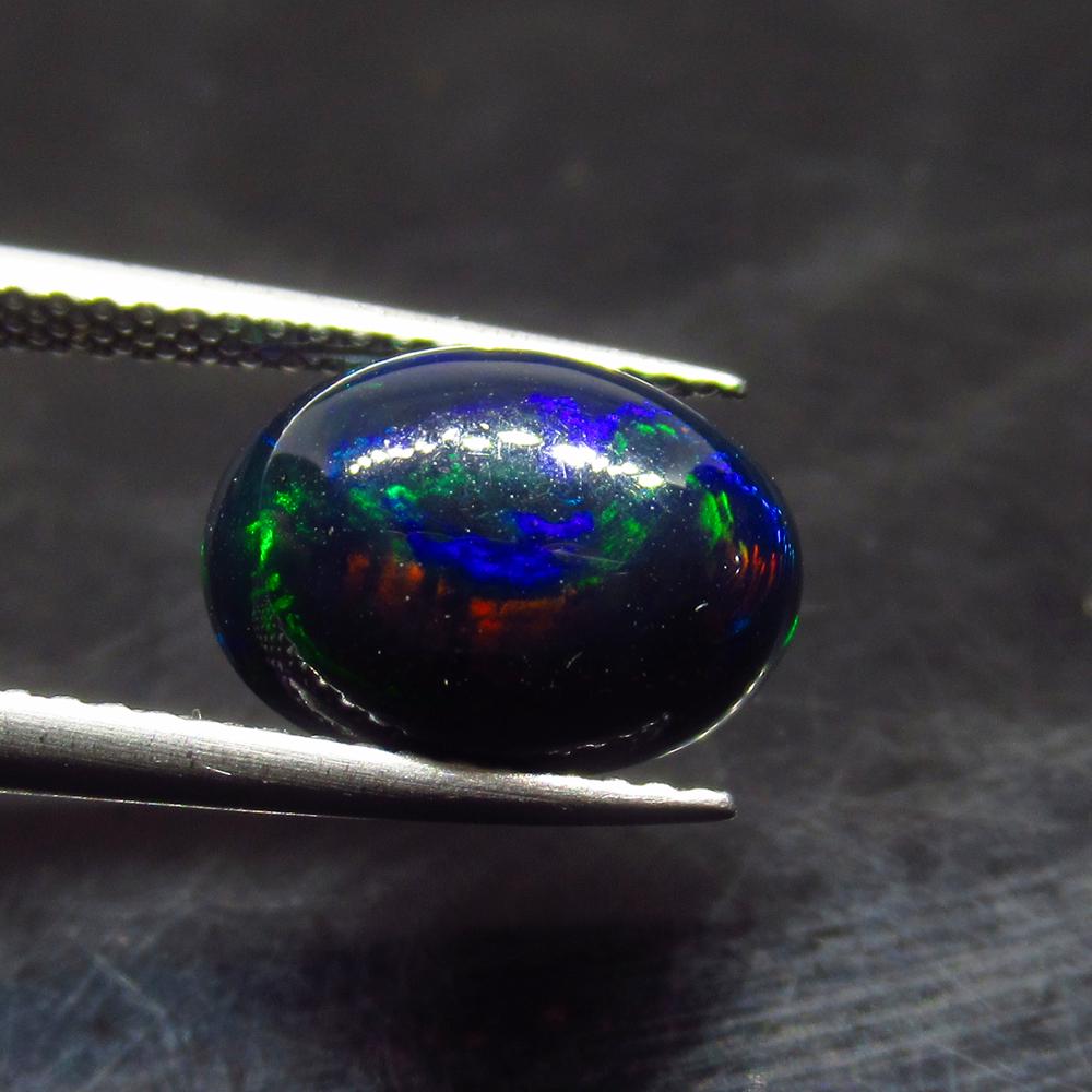 2.97 Ct Natural Ethiopian Black Fire Opal Oval Cab: No Reserve! Title: 2.97 Ct Natural Ethiopian Black Fire Opal Oval Cab Stone Clarity:Translucent Gemstone: Natural Black Opal Carat Weight: 2.97 Size/Dimensions: 12.00 x 8.80 x 6.10 mm Additional Infor