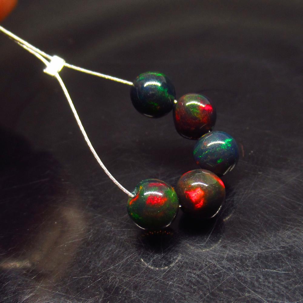 2.88 Ct Natural 5 Drilled Black Opal Ball Beads: No Reserve! Title: 2.88 Ct Natural 5 Drilled Black Opal Ball Beads Stone Clarity:Translucent Gemstone: Natural Black Opal Beads Carat Weight: 2.88 Size/Dimensions: 5.20 to 5.40 mm / 5 PC's Additional 