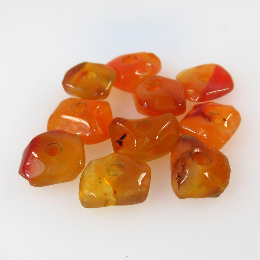 19.40 Ct Natural 10 Drilled Orange Carnelian Unshaped: No Reserve! Title: 19.40 Ct Natural 10 Drilled Orange Carnelian Unshaped Beads Stone Clarity:Semi-Transparent Gemstone: Natural Carnelian Beads Carat Weight: 19.4 Size/Dimensions: 10.0x8.0 - 11.0x9.3 