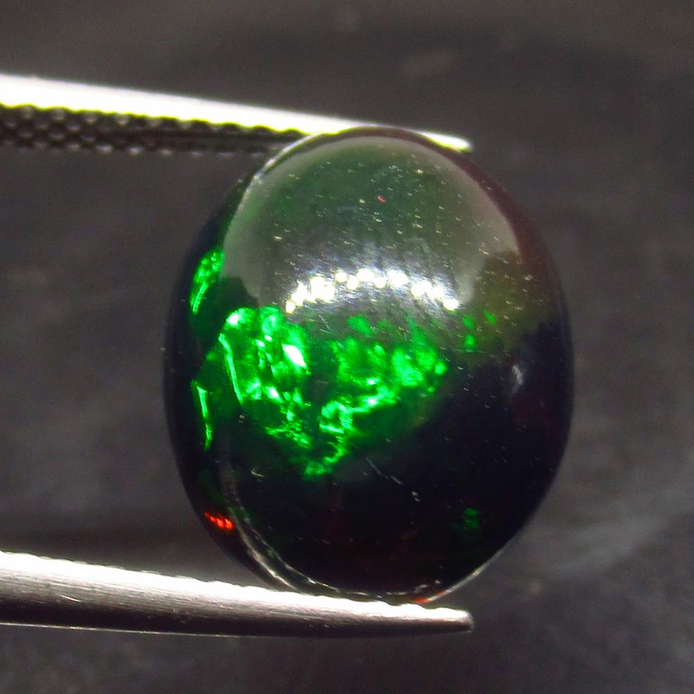 3.80 Ct Natural Ethiopian Black Fire Opal Oval Cab: No Reserve! Title: 3.80 Ct Natural Ethiopian Black Fire Opal Oval Cab Stone Clarity:Translucent Gemstone: Natural Black Opal Carat Weight: 3.8 Size/Dimensions: 13.70 x 10.80 x 5.40 mm Additional Infor