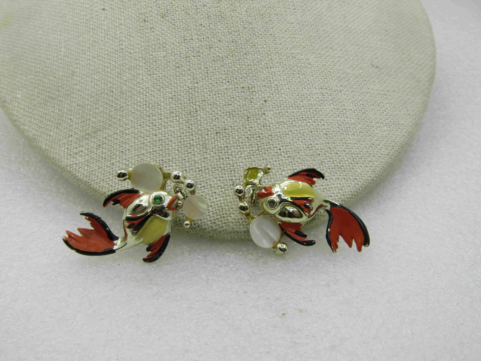 Vintage Pair Enameled Fish Brooches with MOP Bubbles,: Vintage Pair Enameled Fish Brooches with MOP Bubbles, Rhinestone Eyes, Mid-Century. Orange, black, yellow enameling on the fish with a round mother-of-pearl bubbles, faux pearl bubble replacing a moth