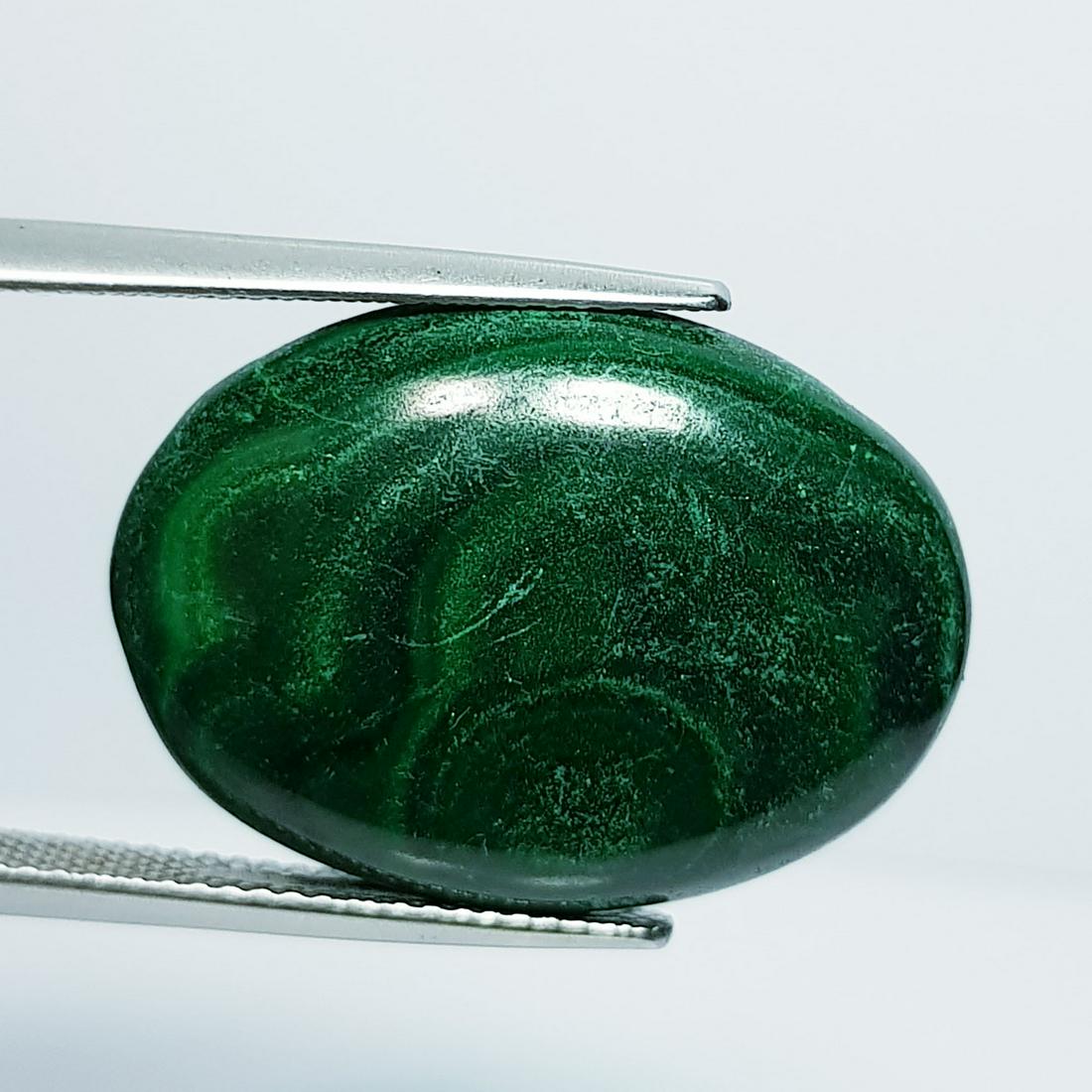 25.79 ct Natural Malachite: No Reserve! Title: 25.79 ct Natural Malachite Color/Clarity:Opaque Carat Weight: 25.79 Size/Dimensions: 24.40 x 17.45 x 5.10 Additional Information: Oval - USA/Egypt Shipping: Domestic: Flat-rate of