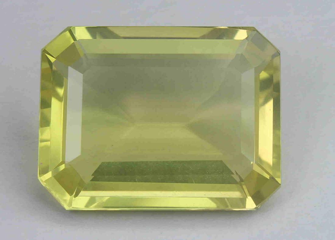 18.35 Cts Natural Lemon Quartz: No Reserve! Gemstone : Natural Lemon QuartzWeight : 18.53 CaratsDimensions : 20.1x15.3x8 mmShape : Emerald CutColour : Greenish Yellow Origin : AfricaTransparency: Transparent Shipping: Domestic: Flat