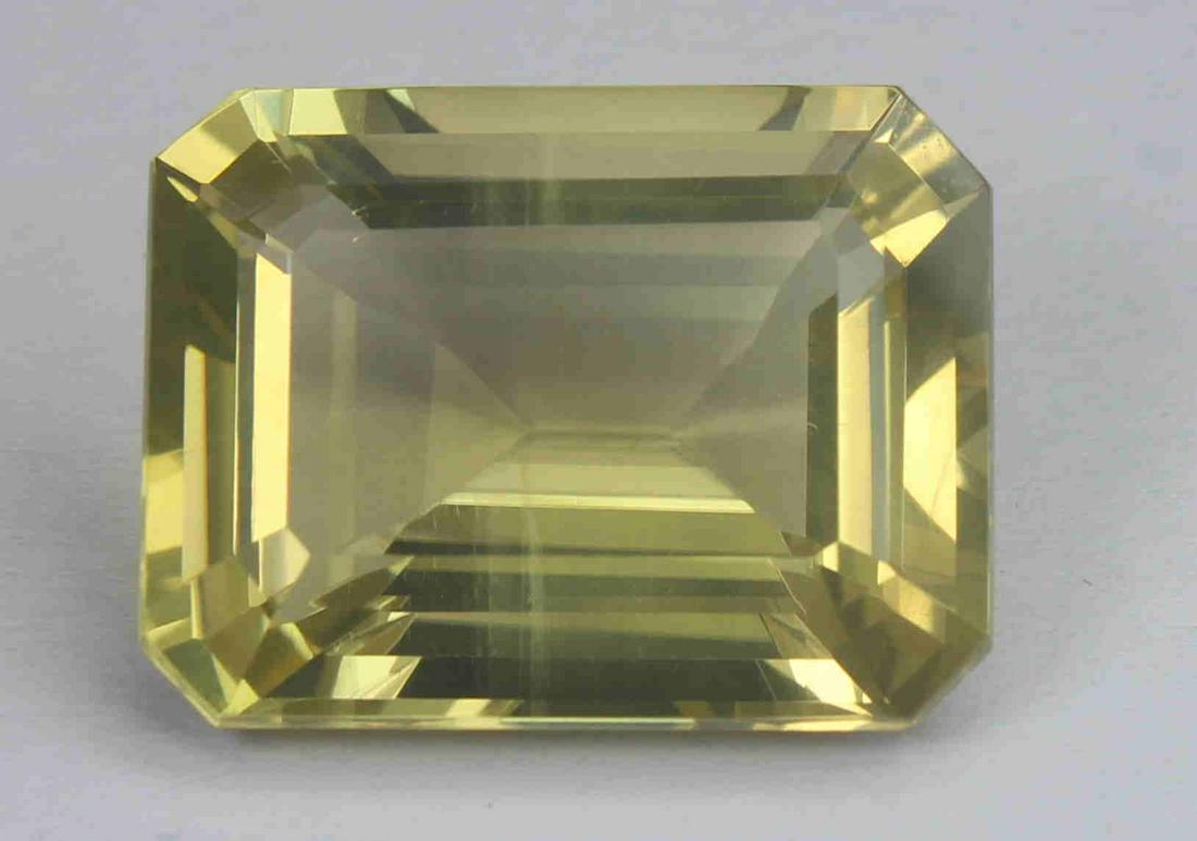 17.15 Cts Natural Lemon Quartz: No Reserve! Gemstone : Natural Lemon QuartzWeight : 17.15 CaratsDimensions : 18.8x14.2x9.1 mmShape : Emerald CutColour : Greenish Yellow Origin : AfricaTransparency: Transparent Shipping: Domestic: Fl
