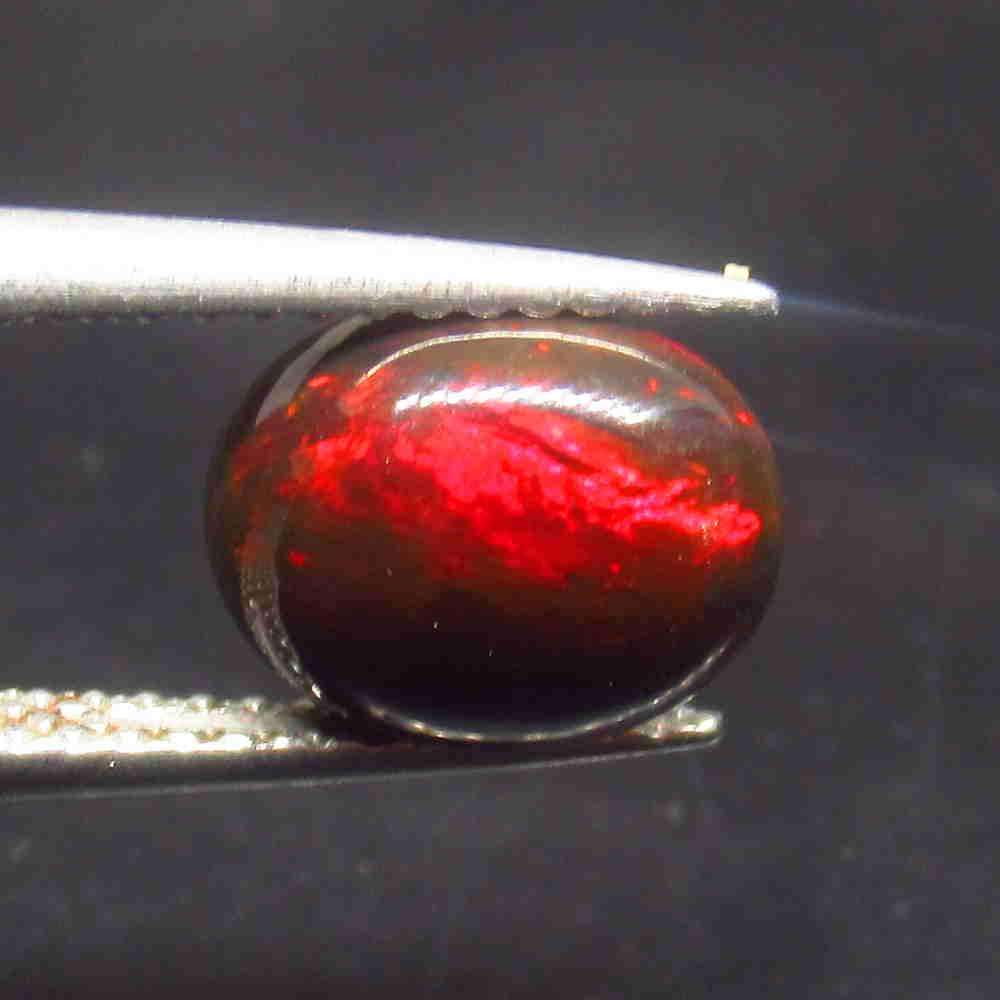 1.23 Ctw Natural Ethiopian Black Fire Opal Oval Cab: No Reserve! Title: 1.23 Ctw Natural Ethiopian Black Fire Opal Oval Cab Color/Clarity: Translucent Gemstone:Black Opal Carat Weight: 1.23 Size/Dimensions: 9.00 x 7.10 x 3.10 mm Additional Information: 
