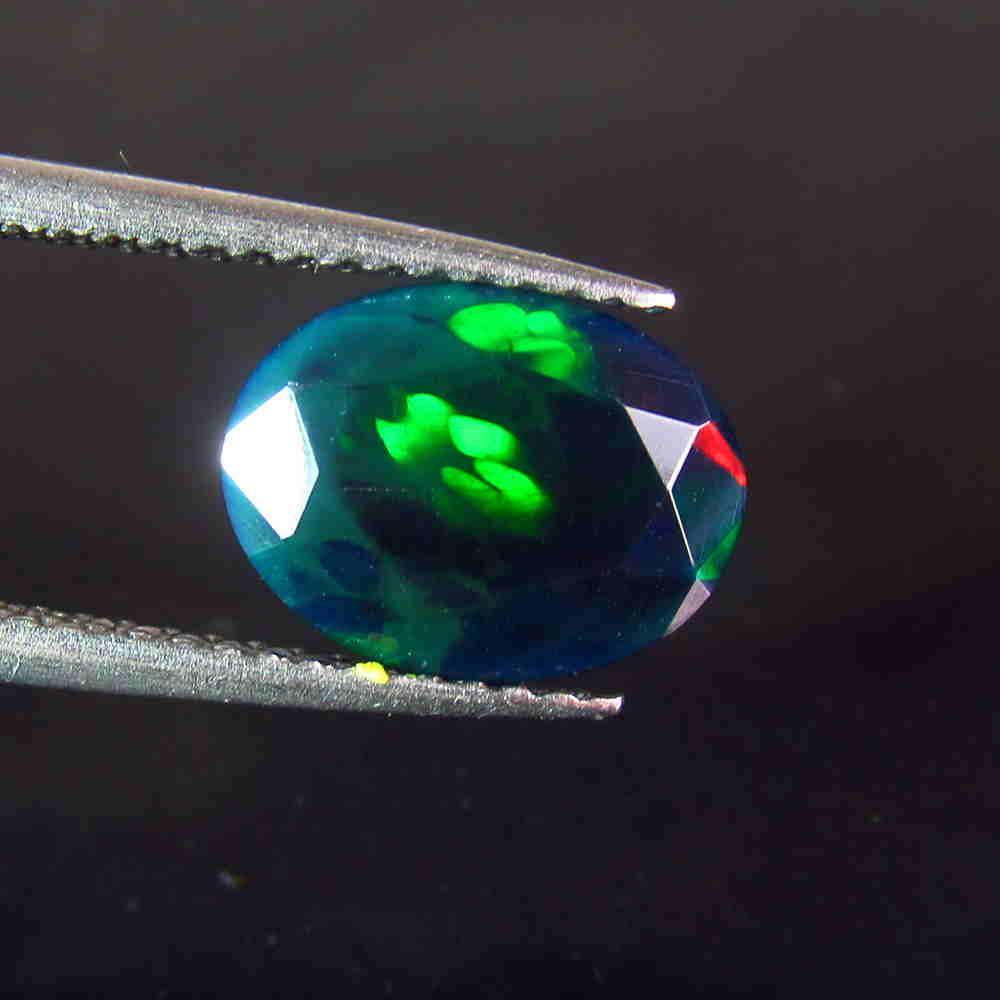 1.25 Ctw Natural Ethiopian Black Fire Opal Oval Cut: No Reserve! Title: 1.25 Ctw Natural Ethiopian Black Fire Opal Oval Cut Color/Clarity: Translucent Gemstone:Black Opal Carat Weight: 1.25 Size/Dimensions: 10.20 x 7.70 x 4.20 mm Additional Information: