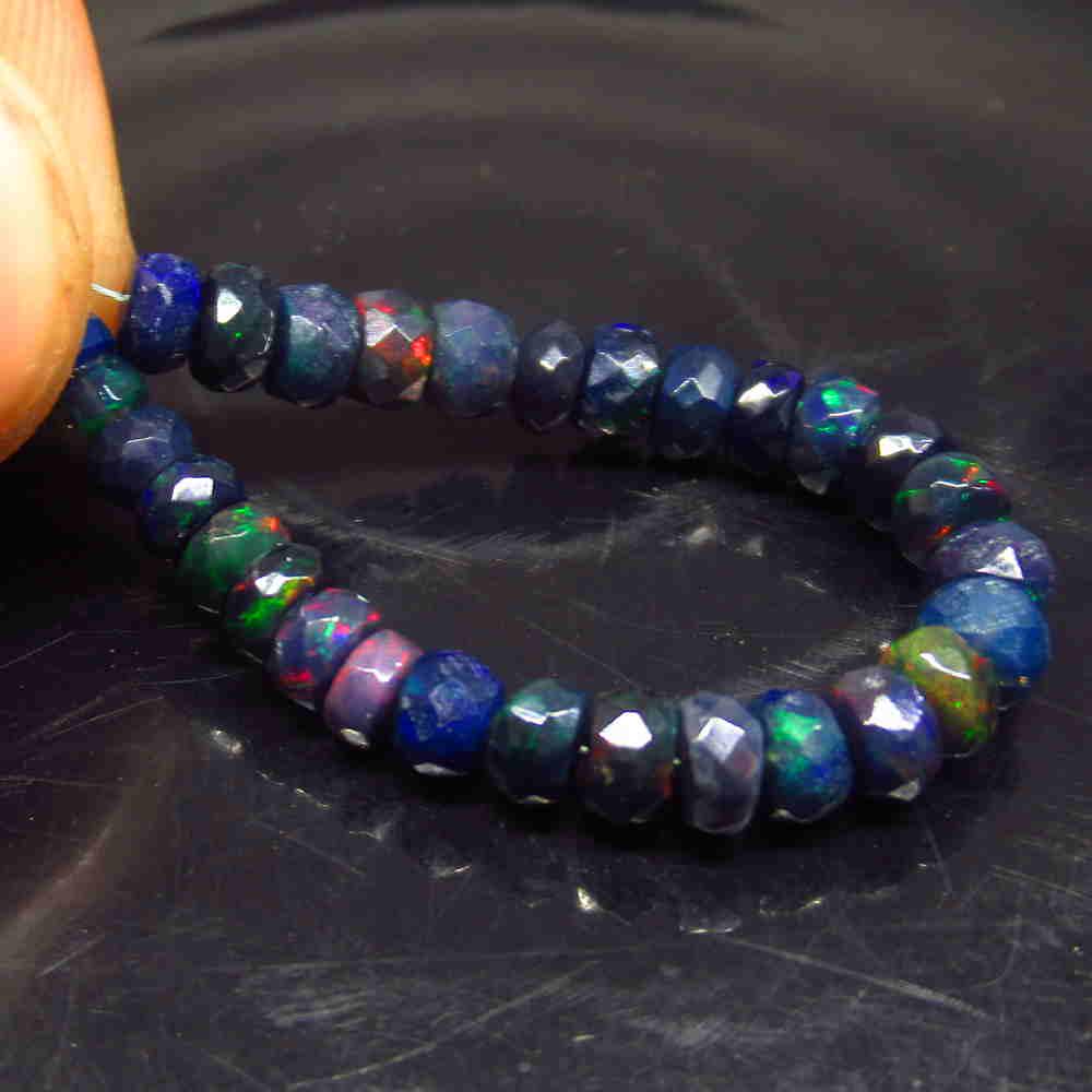 8.31 Ct Natural 29 Drilled Faceted Black Opal Beads: No Reserve! Title: 8.31 Ct Natural 29 Drilled Faceted Black Opal Beads Color/Clarity: Translucent Gemstone:Natural Faceted Black Opal Beads Carat Weight: 8.31 Size/Dimensions: 4.10 to 5.10 mm / 29 PC'