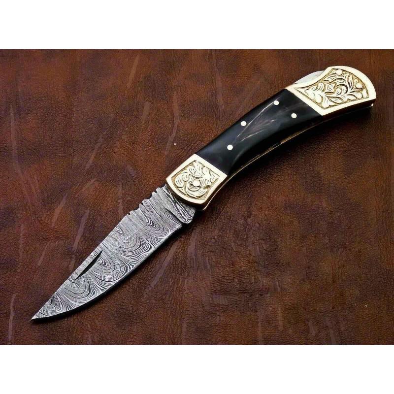 Hunting folding damascus steel knife horn brass pocket: Knife "Aldan" Blade - damask steel Handle – buffalo horn, brass Scabbard – cowhide leather (included) Blade hardness – 55-58 HRC Total length – 197 mm. Blade length - 95 mm. Handle length –