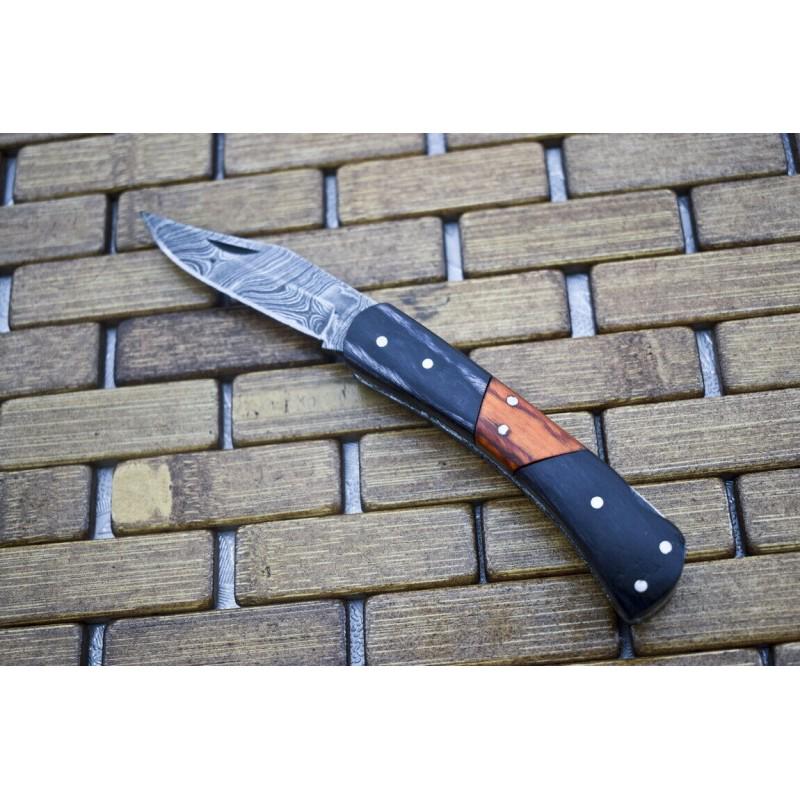 Exclusive pattern folding damascus steel knife wood: Knife "Tinkisso" made of damask steel. Handle – wood and scabbard - genuine leather. Damascus knives are very durable, look great and keep sharpness perfectly. Damascus steel has high quality conten