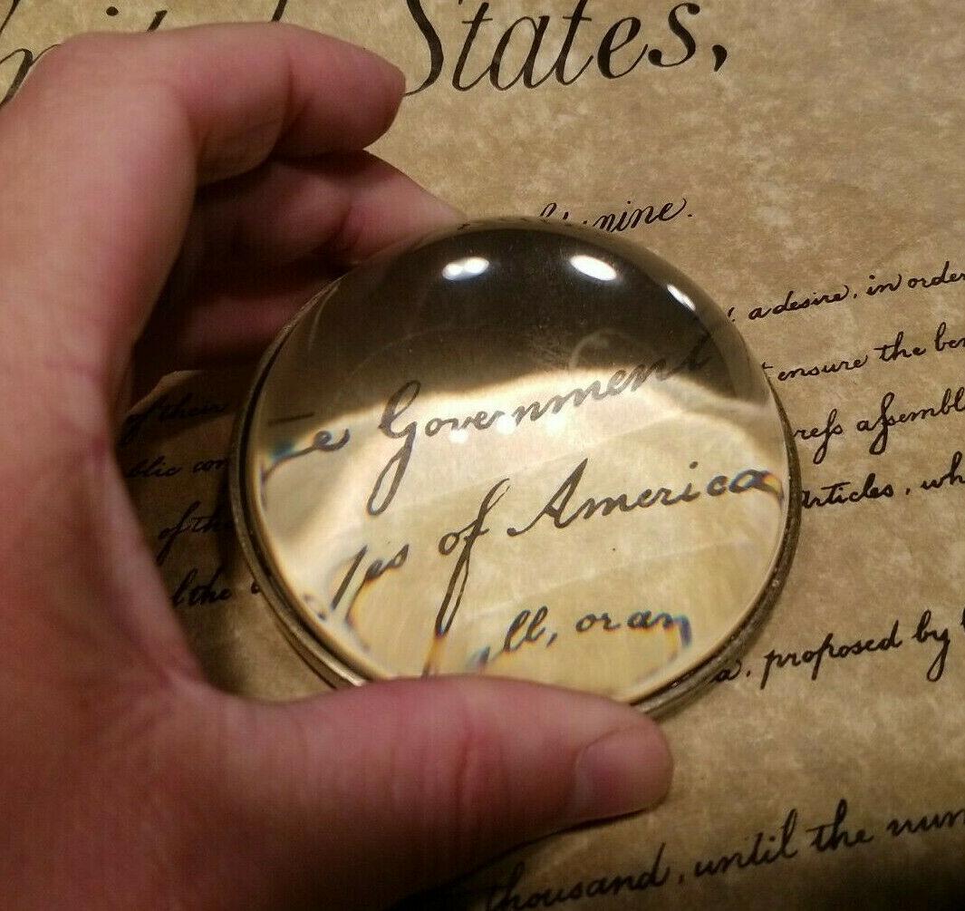 Heavy Glass Magnifying Desk Lens Magnifier: Description 3 1/4" Wide x 1 1/2" High Nice reproduction of an antique magnifying lens. Nice heavy quality thick glass. This piece slides along the surface and magnifies quite well. Magnifying glasses 