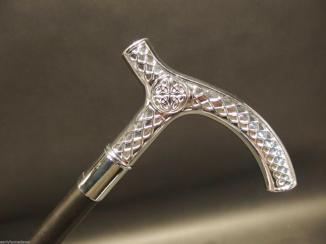 Silver & Black Celtic Metal Slim Walking Stick Cane: 36" Long,.. Handle is 5 1/2" Long 7/8" circumference Wonderful reproduction walking cane, cast from an original. The handle is all heavy solid metal with a hollow metal shaft. Nice quality! Reserve: $
