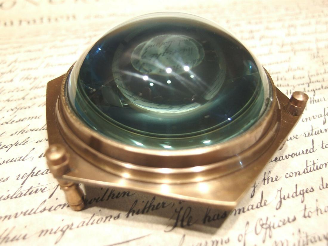 Brass Heavy Glass Magnifying Desk Lens Magnifier: Description 4" Wide x 2" High Nice reproduction of an antique magnifying lens. Nice heavy quality thick glass. This piece slides along the surface and magnifies quite well. Magnifying glasses like thi