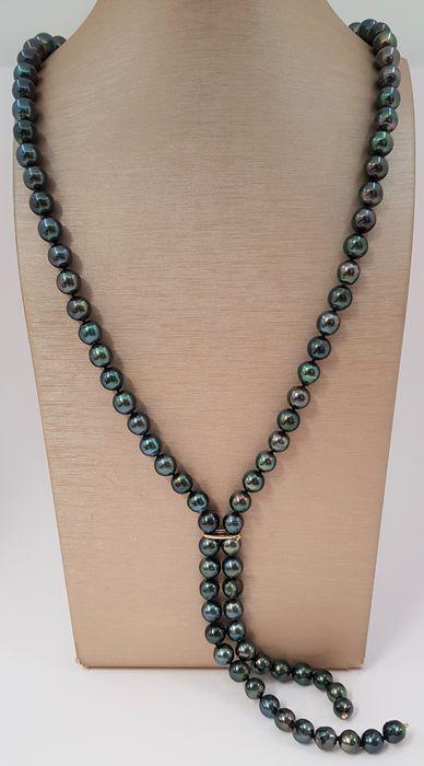 8x11mm Shimmering Peacock Tahitian Pearls - 14 kt.: Title: 8x11mm Shimmering Peacock Tahitian Pearls - 14 kt. Yellow gold - Necklace Description: A beautiful double pearl necklace of peacock green near round Tahitian pearls with exceptional lustre, fin
