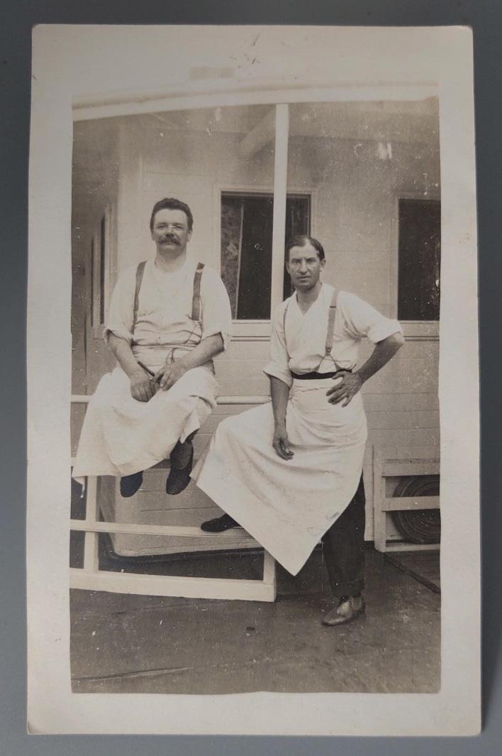 2 Male Chefs? in Aprons Posed Outside: Title: 2 Male Chefs? in Aprons Posed Outside Date/Period: Circa 1910 Dimension: 5 1/2" x 3 1/2" Materials: Matte RPPC Additional Information: Ca. 1910 RPPC of two cleanly attired Men - presumably Chef