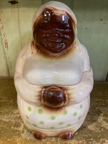 VINTAGE 1930's MAMMY BLACK AMERICANA COOKIE JAR: Title: VINTAGE 1930's MAMMY BLACK AMERICANA COOKIE JAR Provenance/Additional Info: Sometimes refered to as Aunt Jemima. She is simply charming in her dress with the green polka dots. Date/Period: APPR