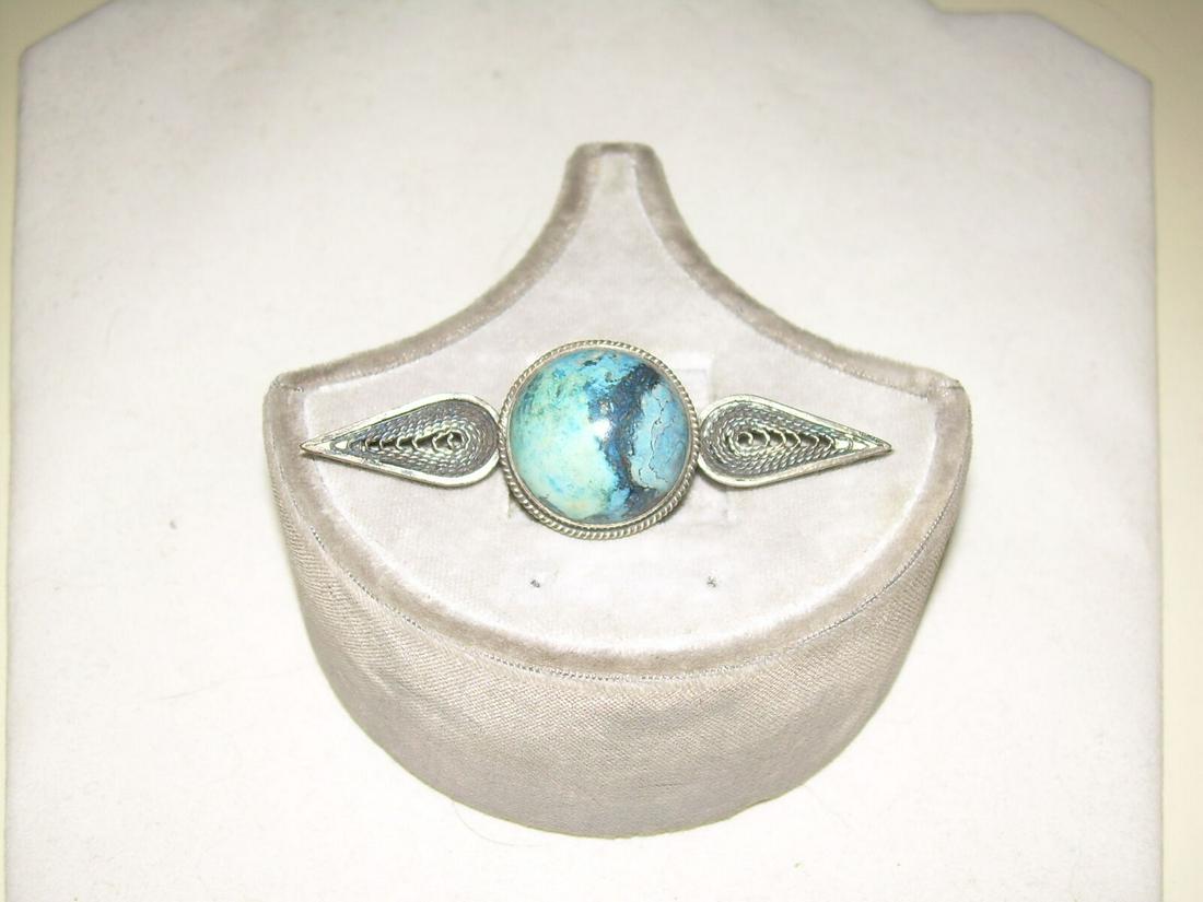 Sterling Silver Amazonite Brooch - 40's-50's, Vintage: This lovely truly vintage brooch is from the 40's-50's. I believe this is amazonite but has the colors of labrodite. It is sterling silver and weighs 10.49 grams. It measures 2.5" wide and .75" long.