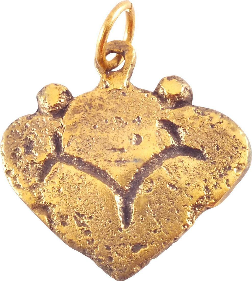 VIKING HEART PENDANT NECKLACE C.850-1050 AD: Just over 3/4" height including the loop. Made by the open face mold method. Heart form with nubbed shoulders and of low rounded section. The field with an incised trefoil. The heart stood for bravery