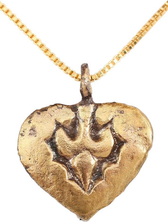 EXTRAORDINARY VIKING HEART NECKLACE 850-1050 AD: Fine example in its fully evolved form. Over 3/4" height including the suspension loop. Fully evolved heart form with the sides scrolling at the top and forming the cusp. The field with a trefoil. Mad