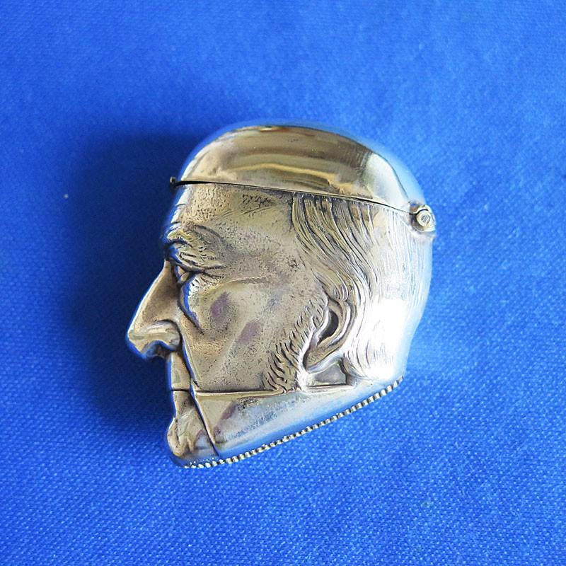 Figural Cardinal Wolsey match safe, by Samuel Basnett: Title: Figural Cardinal Wolsey match safe, by Samuel Basnett c. 1886 Dimensions: 1 7/8 x 1 3/4 inches Date/Period: c. 1886 Material: Silver plated Description: Samuel Basnett identified as maker based