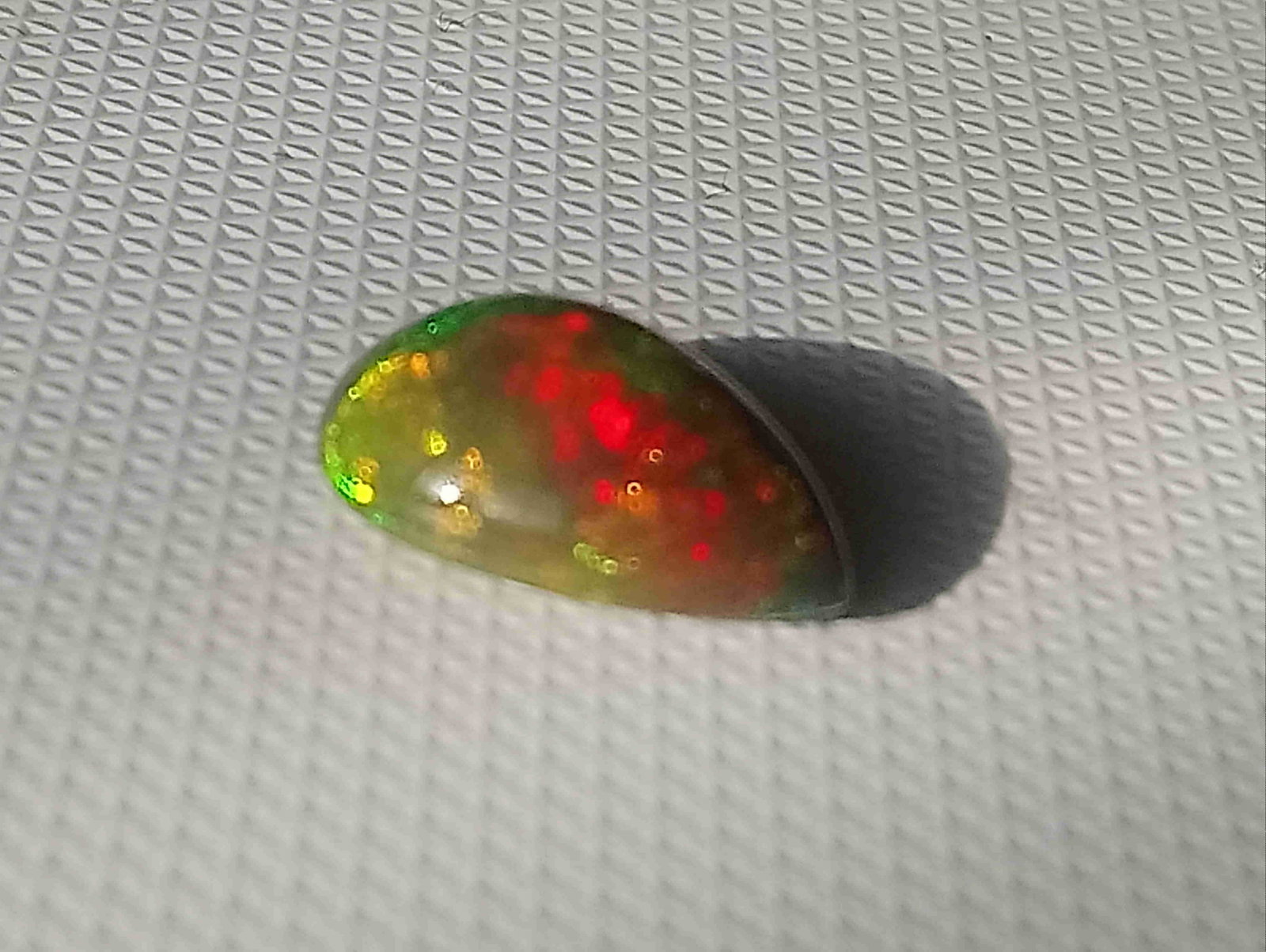 Natural black opal: Title: Natural black opal Color/Clarity: black/opaque Gemstone Type: natural/heated Carat Weights: 2.51 Size/Dimensions: 12.87x8.86x4.85 mm Additional Information: Origin: Ethiopia Reserve: $90.00 S