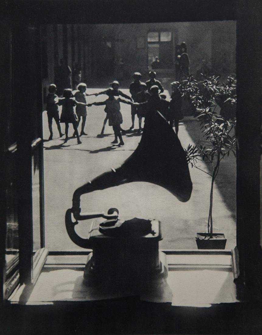 MARTIN MUNKACSI - Tenement Life: Artist: Martin Munkacsi Title: Tenement Life Medium: Sheet Fed Gravure, 1932 France Dimensions: 8.9x11.15" Additional Information: Heat Wax Mounted on 14x18" Conservation Board Artist Bio: Martin Munk