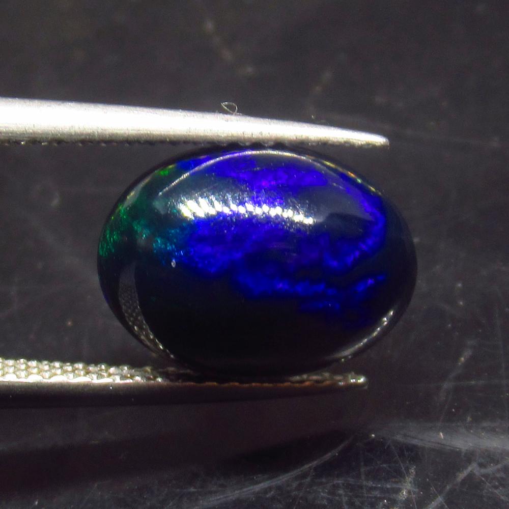 2.43 Ct Natural Ethiopian Black Fire Opal Oval Cab: No Reserve! Title: 2.43 Ct Natural Ethiopian Black Fire Opal Oval Cab Stone Clarity: Translucent Gemstone: Natural Black Opal Carat Weight: 2.43 Size/Dimensions: 12.00 x 9.00 x 5.10 mm Additional Info