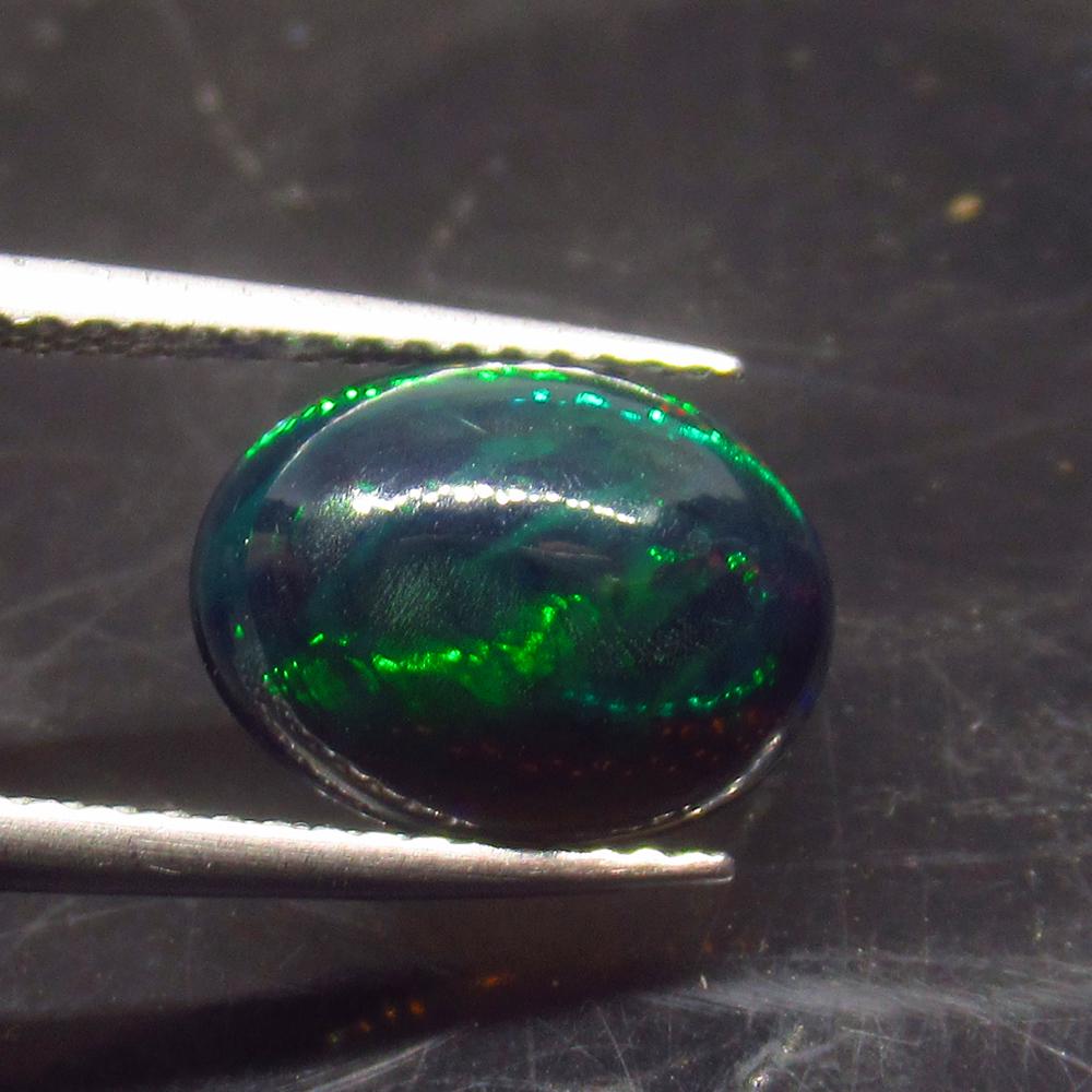 1.88 Ct Natural Ethiopian Black Fire Opal Oval Cab: No Reserve! Title: 1.88 Ct Natural Ethiopian Black Fire Opal Oval Cab Stone Clarity: Translucent Gemstone: Natural Black Opal Carat Weight: 1.88 Size/Dimensions: 11.90 x 8.60 x 4.40 mm Additional Info