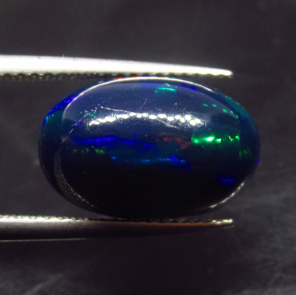4.50 Ct Natural Ethiopian Black Fire Opal Oval Cab: No Reserve! Title: 4.50 Ct Natural Ethiopian Black Fire Opal Oval Cab Stone Clarity: Translucent Gemstone: Natural Black Opal Carat Weight: 4.5 Size/Dimensions: 14.60 x 9.50 x 6.50 mm Additional Infor