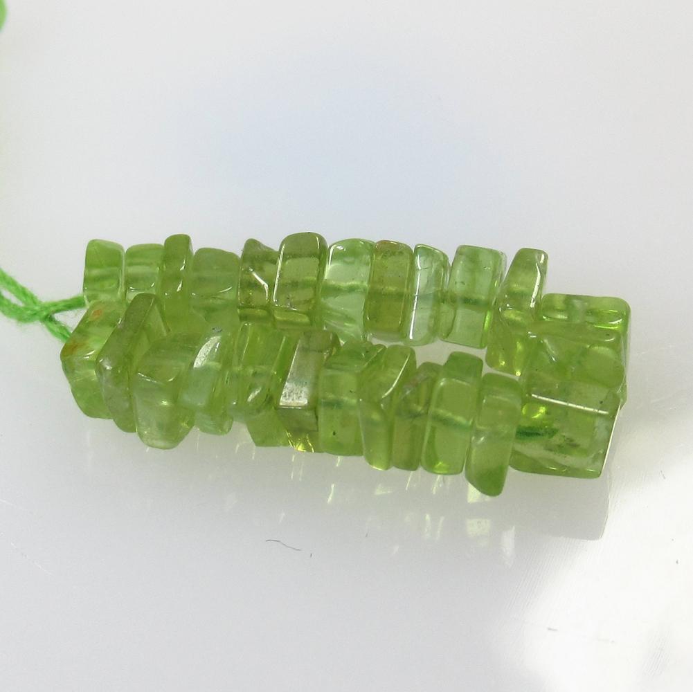 9.26 Ct Natural 26 Drilled Peridot Square Beads: No Reserve! Title: 9.26 Ct Natural 26 Drilled Peridot Square Beads Stone Clarity: Transparent Gemstone: Natural Peridot Beads Carat Weight: 9.26 Size/Dimensions: 4.2x4.2 to 4.4x4.4 mm / 26 PC's Additi