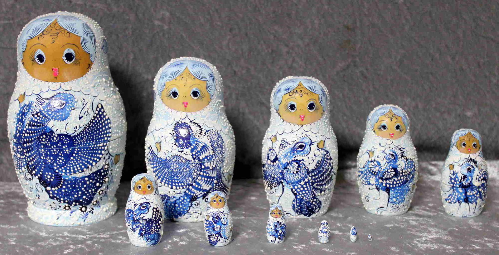 Matreshka, nesting doll: Dimensions: 0.0 × 9.0 × 16.0 cm Matreshka, Russian hand-made and hand-painted nesting doll, Stacking doll; 11 pieces with white blue ornaments . Reserve: $100.00 Shipping: Domestic: Flat-rate of $50