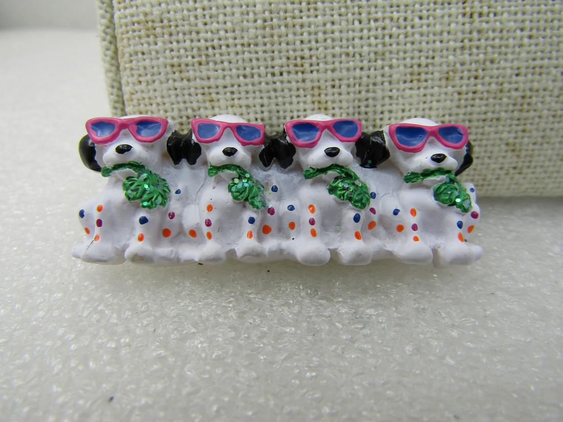 Vintage White Dogs in Sunglasses Bar Brooch,: Vintage White Dogs in Sunglasses Bar Brooch, White/Black, 1.75" by .75", four white dogs with a green leaf type color in their mouth, with dotted design and glitter in the leave wearing magenta sungla