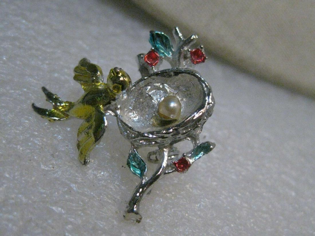 Vintage Bird with Nest and Egg Brooch, Two-Tone,: Vintage Two-Tone Bird, Nest, Egg Brooch - very cute little bird's next in silver tone sitting on a silver tone branch with blue enameled leaves and pink rhinestones with a faux pearl egg in the next.