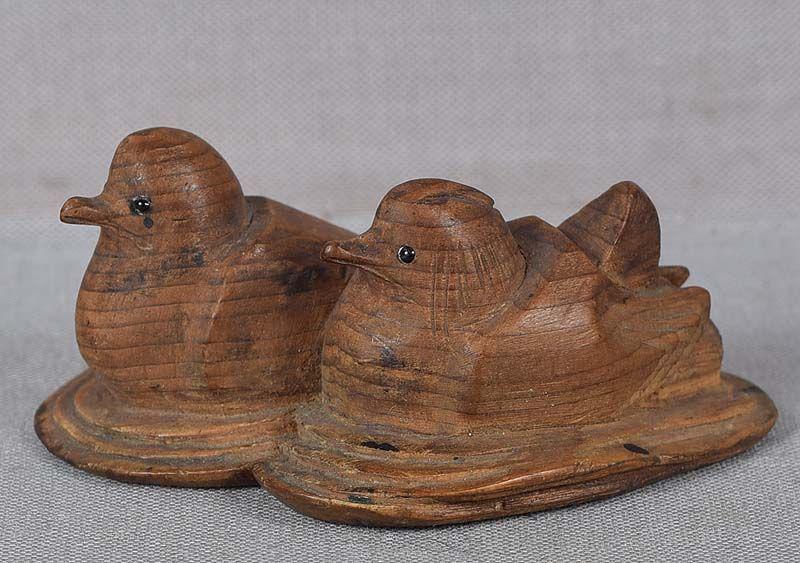 19c Hida school netsuke floating MANDARIN DUCKS: 19th century wooden netsuke of a Mandarin ducks couple floating ona pond. Perfectly captured serene mood of the scene, very nice quality piece typical for the Hida school carved out of yew wood with i
