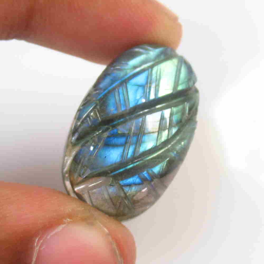 32.07 Ctw Natural Labradorite Carving: No Reserve! Title: 32.07 Ctw Natural Labradorite Carving Stone Clarity: Opaque Gemstones: Labradorite Size/Dimensions: 32.07 Carat Weights: 27.00 x 16.40 x 8.00 mm Additional Information: Nice Carving
