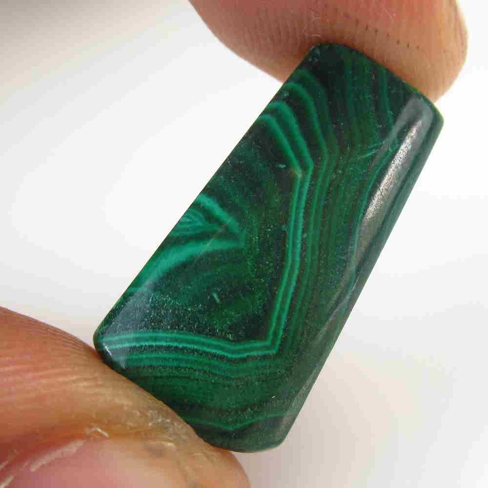 17.55 Ctw Natural Green Malachite Fancy Cab: No Reserve! Title: 17.55 Ctw Natural Green Malachite Fancy Cab Stone Clarity: Opaque Gemstones: Malachite Size/Dimensions: 17.55 Carat Weights: 22.00 x 11.00 x 5.00 mm Additional Information: Drilled