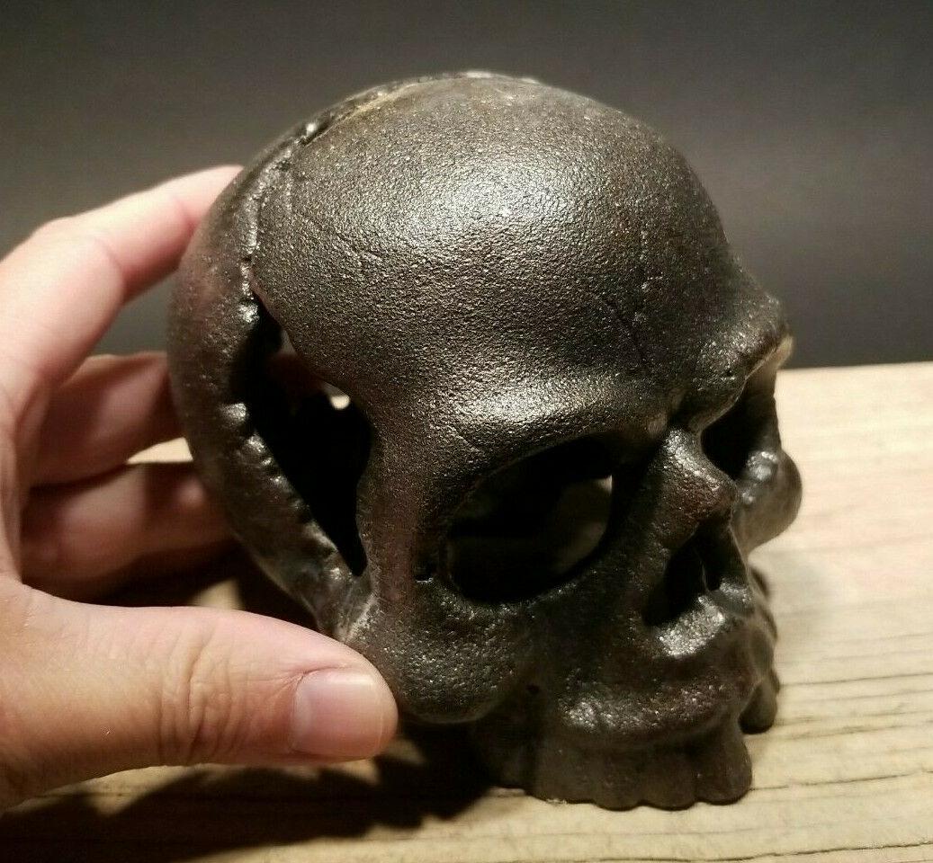 ron Steel Skull Paperweight: 4" W x 4 1/2" tall Such neat reproduction antique iron skull. Surprisingly heavy and solid. Great metal finish! Reserve: [$20.00 Shipping: Domestic: Flat-rate of $20.00 to anywhere within the contiguo