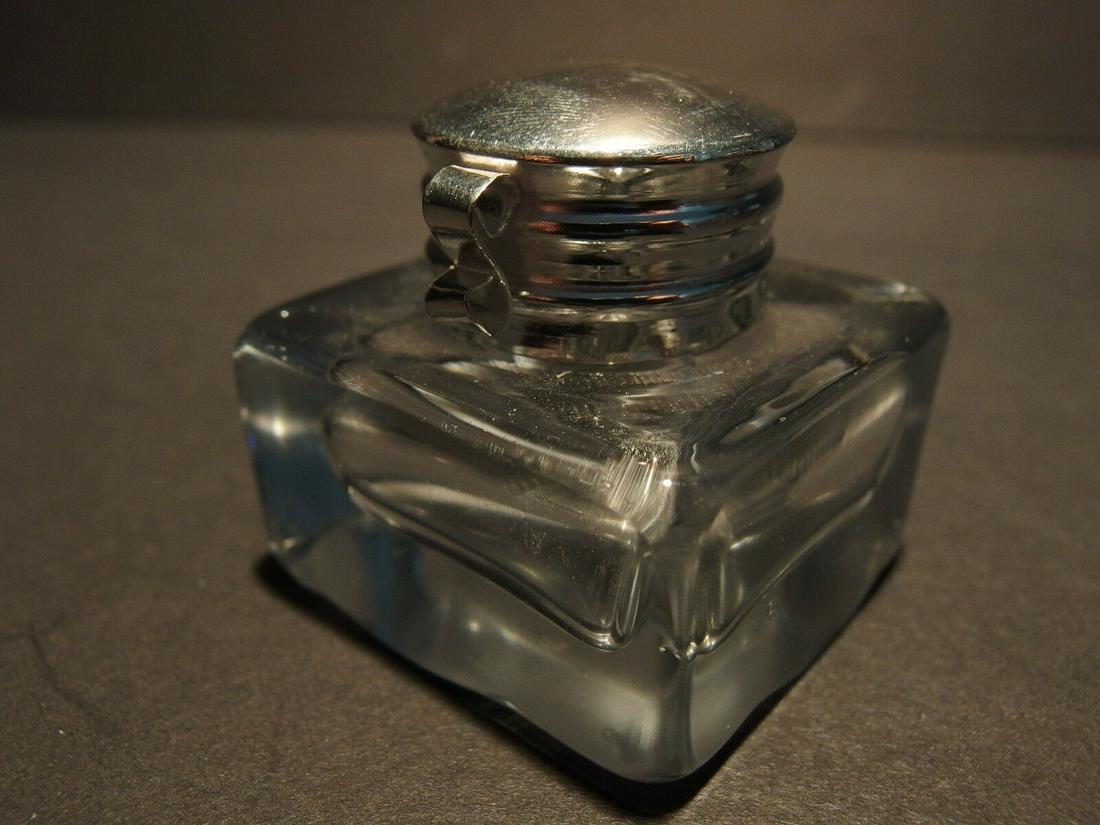 Clear Square Thick Glass Inkwell Ink pot Bottle: Charming 1 3/4" High x 1 3/4" wide Reproduction antique clear glass inkwell. Very heavy thick clear glass each with charming subtle signs of being hand made. The hinged shiny lid is nickel plated bras