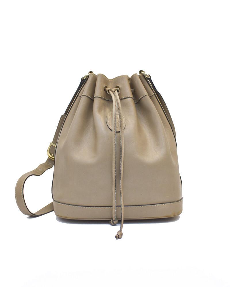 Mark Cross Taupe leather drawstring bag: Mark Cross taupe box leather draw string bag from the early 80's. Inspiration for the It bag of fall 2014. In very good condition with normal signs of wear. Adjustable should strap, bucket shape with