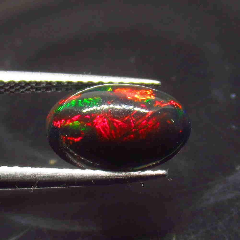 1.76 Ctw Natural Ethiopian Black Fire Opal Oval Cab: Title: 1.76 Ctw Natural Ethiopian Black Fire Opal Oval Cab Stone Clarity: Translucent Gemstones: Black Opal Size/Dimensions: 1.76 Carat Weights: 11.60 x 8.00 x 4.50 mm Additional Information: Excellen