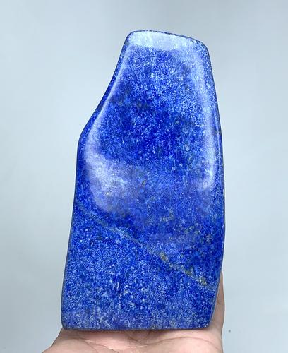 602 Gram Deep Blue Hand Made Lapis Lazuli Tumble: Title: 602 Gram Deep Blue Hand Made Lapis Lazuli Tumble Weight: 602 Gram Size/Dimensions: 132x70x35 mm Origin: Afghanistan Reserve: $45.00 Shipping: Domestic: Flat-rate of $25.00 to anywhere within th