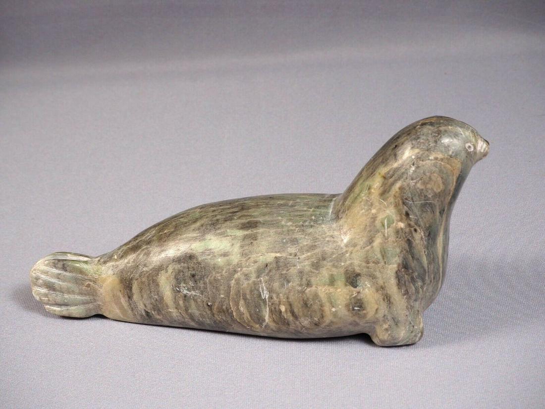 Inuit Eskimo Native American Signed Soapstone Carving: This is a vintage Primitive Native American Eskimo Inuit Seal/Walrus Figurine. The figurine is made from soapstone and is very beautiful. It is signed at the bottom "Bart Hanna - E5 640 - Igloolik - N