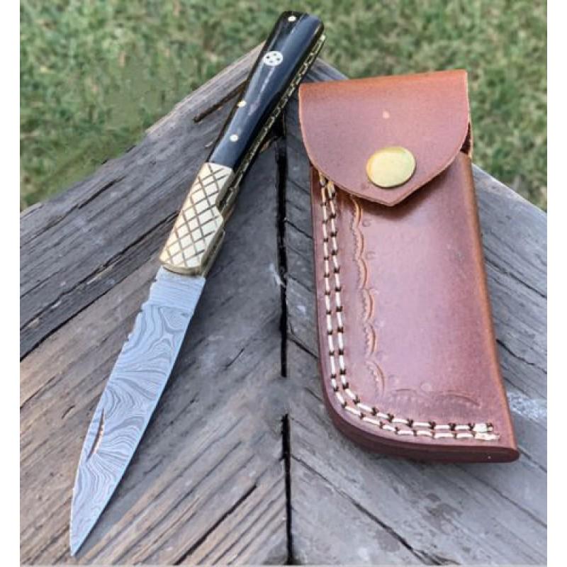 Inner lock damascus steel knife folding horn leather: Knife "Bowie" made of damask steel. Handle – black horn and scabbard - genuine leather. Damascus knives are very durable, look great and keep sharpness perfectly. Damascus steel has high quality con