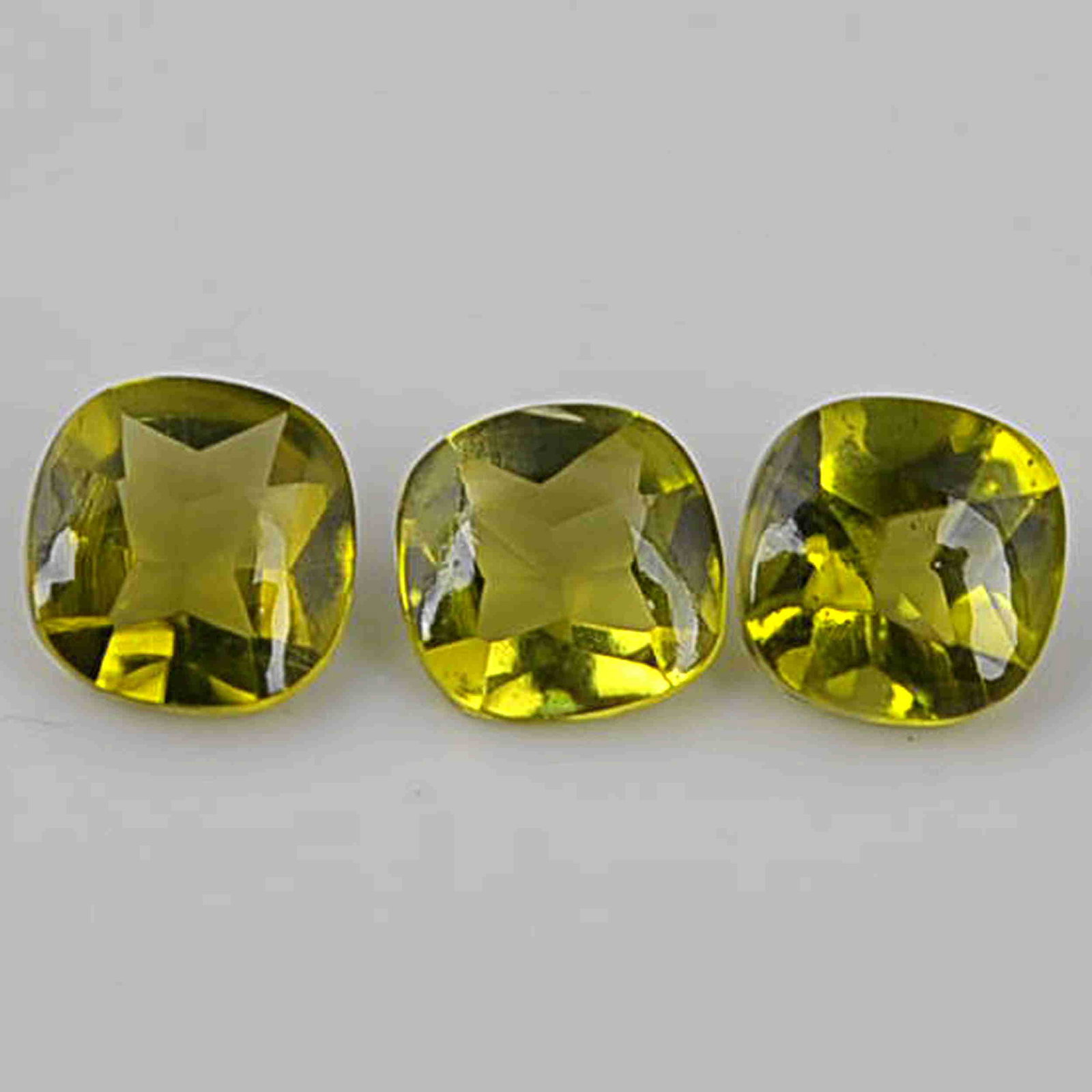 1.75 Carat Green Color Natural Cushion Peridot Loose: No Reserve! Title: 1.75 Carat Green Color Natural Cushion Peridot Loose Gemstone 3 Pieces Gemstones: Peridot Carat Weights: 1.75 Size/Dimensions: 2.5H x 5L x 5W mm Shipping: Domestic: Flat-rate of $7.